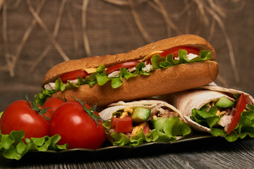 Burrito with grilled chicken and vegetables, Shawarma Sandwich, Doner Kebab, Chicken Shawarma, Subway sandwich on wooden table