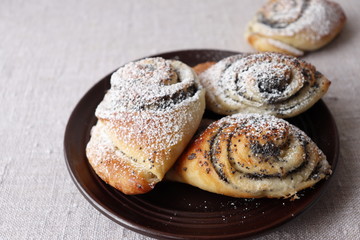 Buns of yeast dough with a poppy filling