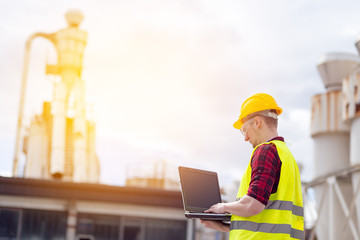 Industrial worker using laptop