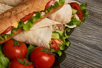 Burrito with grilled chicken and vegetables, Shawarma Sandwich, Doner Kebab, Chicken Shawarma, Subway sandwich on wooden table