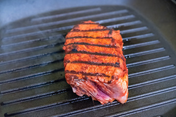 Three steaks roasted on the grill