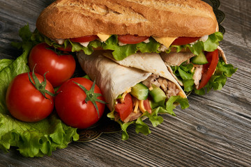 Burrito with grilled chicken and vegetables, Shawarma Sandwich, Doner Kebab, Chicken Shawarma, Subway sandwich on wooden table