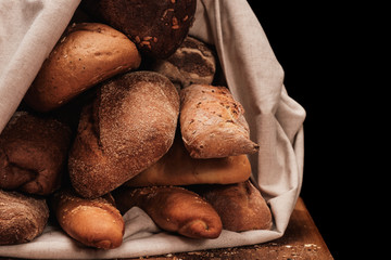 Fragrant bread in textile bag or table cloth
