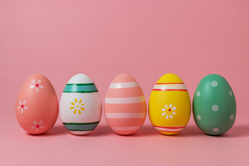 Colorful easter eggs on pink background. Easter concept.