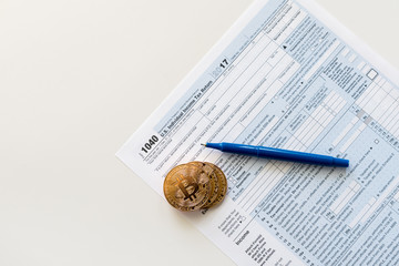 IRS 1040 tax form used to calculate capital gain or loss for bitcoin trading