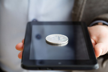 Hand holding smart phone with bitcoin concept on screen.