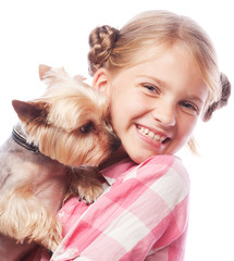 Happy girl holding her lovely yorkshire terrier dog.