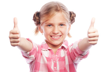 happy little girl child standing isolated over white background. Looking camera showing thumbs up.