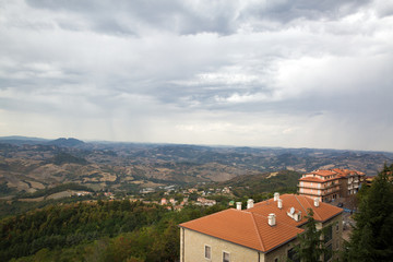 Fototapeta na wymiar San Marino top view. Beautiful panoram of San Marino. Dark heavy sky, Italy.