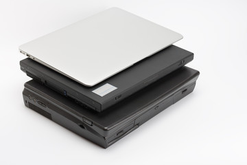 Comparing of laptops, new modern and old laptops, present and past