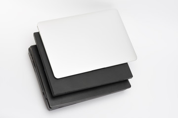 Comparing of laptops, new modern and old laptops, present and past