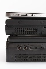 Obraz premium Comparing of laptops, new modern and old laptop, present and past