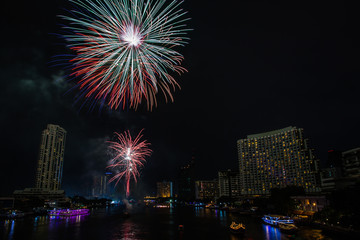 Fototapeta premium Night view of Taksin bridge in Bangkok with firework