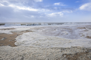 beach with sea foam before the storm Carmen hits the coast of La Faute Sur Mer, Vendee, France