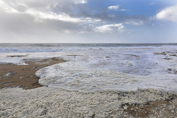 beach with sea foam before the storm Carmen hits the coast of La Faute Sur Mer, Vendee, France