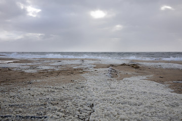 beach with sea foam before the storm Carmen hits the coast of La Faute Sur Mer, Vendee, France