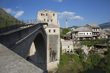 Fototapeta na wymiar View of the single-arch Old Bridge or Stari Most Neretva over River in Mostar, Bosnia and Herzegovina. The Old Bridge was destroyed in 1993 by Croat military forces during the Croat–Bosniak War. 