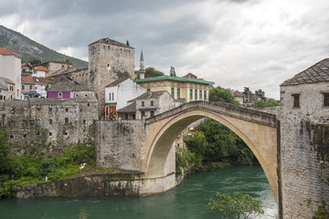 View of the single-arch Old Bridge or Stari Most Neretva over River in Mostar, Bosnia and Herzegovina. The Old Bridge was destroyed in 1993 by Croat military forces during the Croat–Bosniak War. 