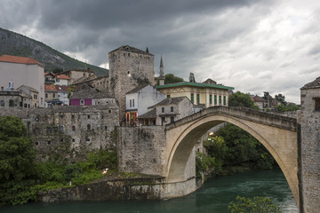 Fototapeta premium View of the single-arch Old Bridge or Stari Most Neretva over River in Mostar, Bosnia and Herzegovina. The Old Bridge was destroyed in 1993 by Croat military forces during the Croat–Bosniak War. 