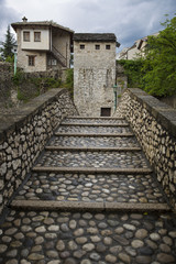 Fototapeta na wymiar Stone stairs of an old arch bridge in Unesco area of old town Mostar, Bosnia and Herzegovina
