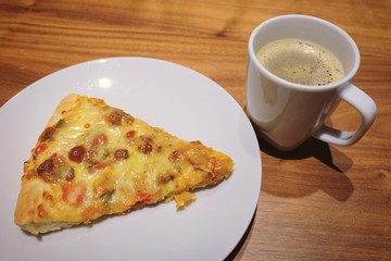 Cup of Hot Coffee with Delicious Pizza