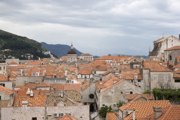 Fototapeta na wymiar View over the orange rooftops of old town Dubrovnik from the ancient city wall with cloudy weather, Croatia