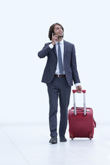 successful businessman with travel suitcase