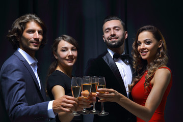 Cheerful people celebrating a sucess with Champagne