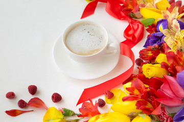 Fototapeta na wymiar white forfor-cup with a cup of coffee around which lie tulips, nartsisov, and orchade with a red bow and raspberries on a white background
