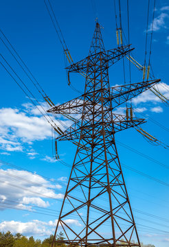  high-voltage  power lines at sunset.