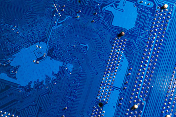 blue circuit board background of computer motherboard