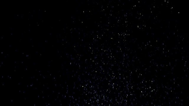 Real golden dust falling down in front of black background. This footage can be used on first plan of different videos by blend modes Overlay or Screen. Shot on RED cinema camera .
