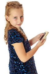 Little girl holding a mobile phone