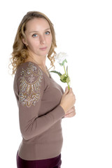 Young woman with a flower in her hands