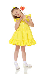 Little girl with a candy on a stick