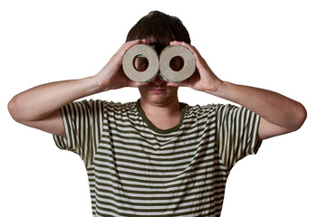 man in a striped T-shirt is looking through a roll of toilet paper, isolated on white