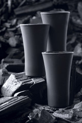 Three matte black shot glass .On charcoal background. Black edition.Creative.Let's drink.Cheers.Mockup.Copy space.Pour it.Still life