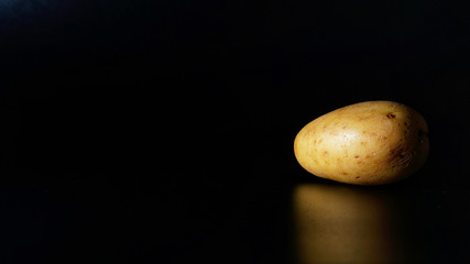 Potatoes isolated with black background
