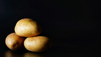Potatoes isolated with black background