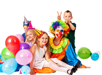 Obraz na płótnie Canvas Birthday child clown playing with children and bunny fingers prank. Kid holiday cakes celebratory and balloons the happiest birthday. Mom arranged holiday for her daughter.