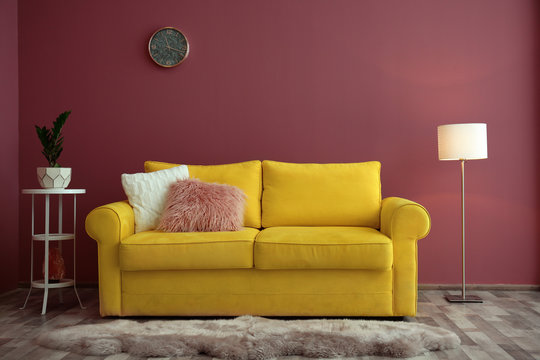 Elegant room interior with comfortable sofa