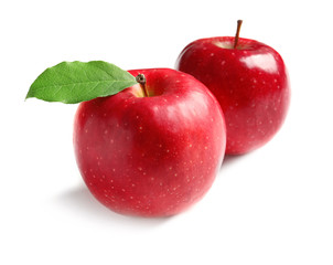 Ripe red apples on white background