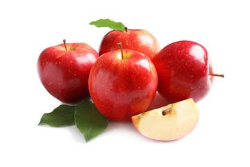 Ripe red apples with slice on white background