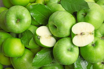 Fresh green apples as background