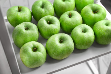 Fresh green apples on shelf