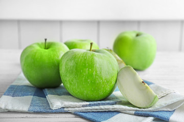 Fresh green apples on wooden table