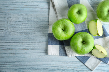 Fresh green apples on wooden table, top view