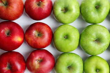 Fresh green and red apples as background