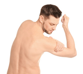 Fototapeta premium Young man suffering from shoulder pain on white background