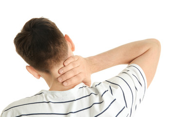 Young man suffering from neck pain on white background